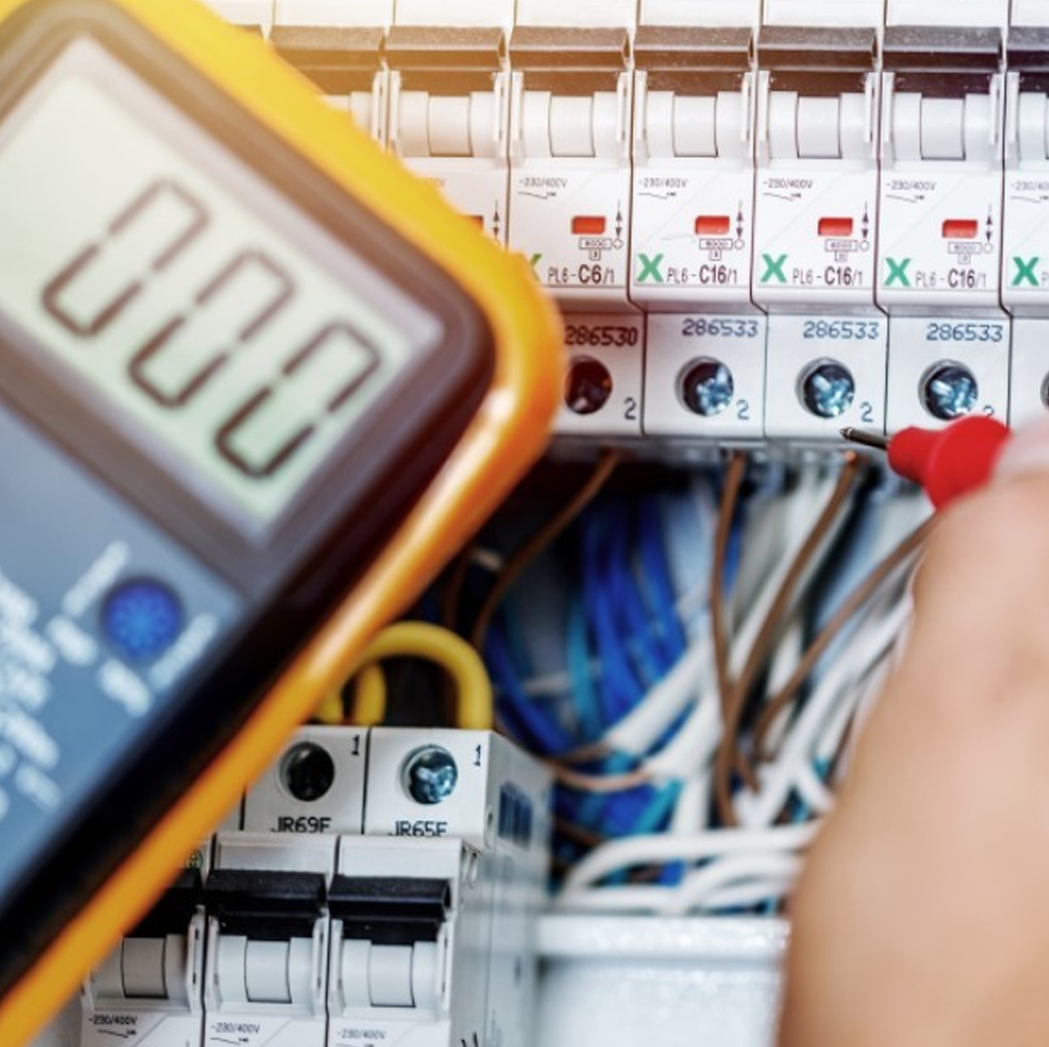 electrician with multimeter